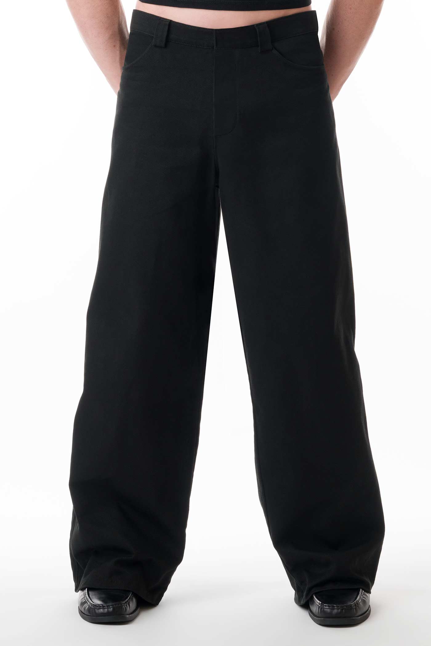 Men's black denim trousers with asymmetrical pockets